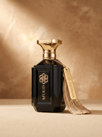 D'Or Davana Extrait de Parfum — lifestyle view of the gold-capped flacon